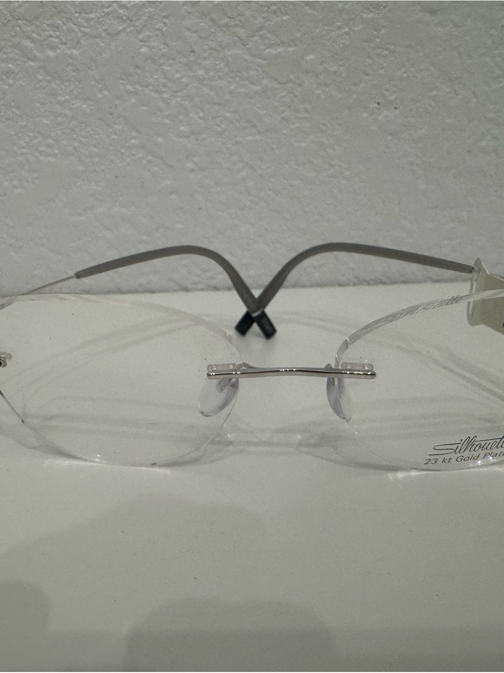 Silhouette Rimless Glasses with Silver Bridge and Gray Temples